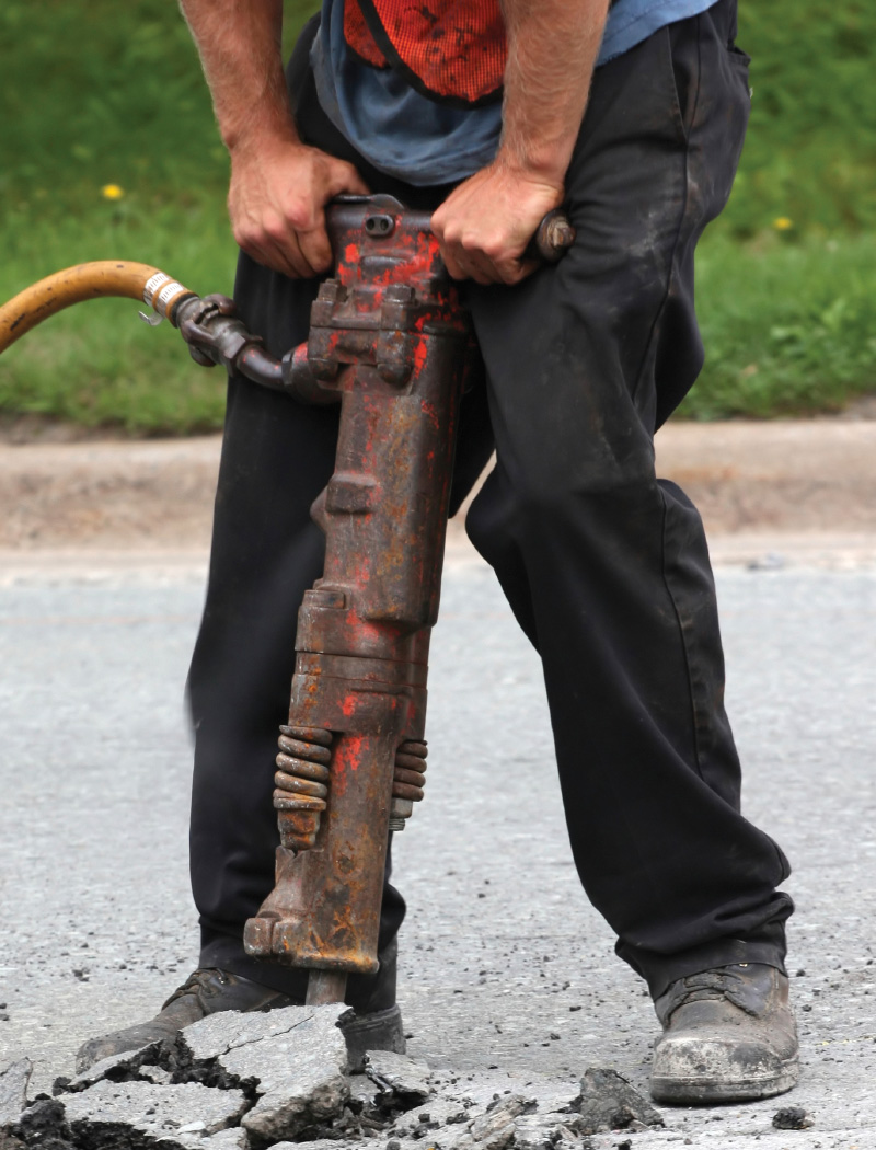 case-studies-underground-lines Worker jackhammering concrete