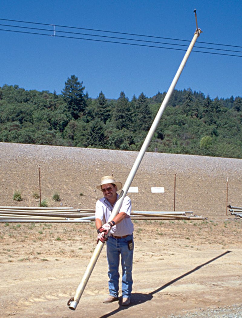 case-studies-watch-irrigation-pipes Worker carrying irrigation pipe